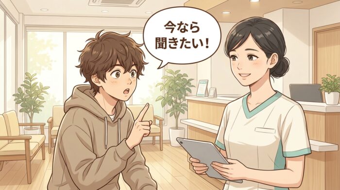 悩みに直面して前のめりに質問する人と、穏やかに応える歯科医師