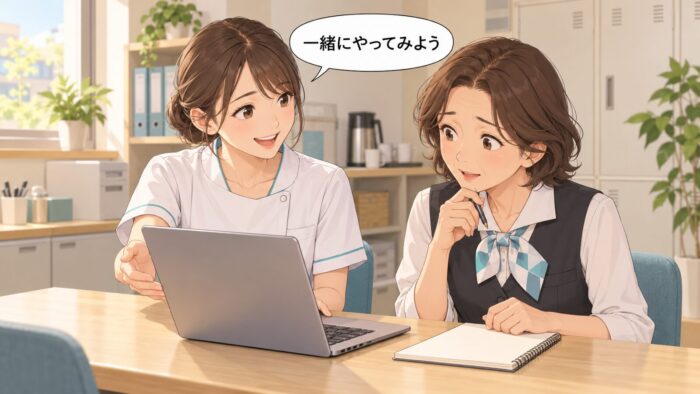 きれいな字で帳面を書き上げる受付スタッフと、隣でノートパソコンを開いて見せる歯科衛生士